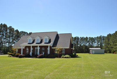 Cape cod home with a front yard | Image 2