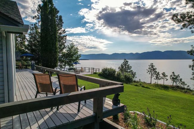 Wooden terrace featuring a water and mountain view and a lawn | Image 7