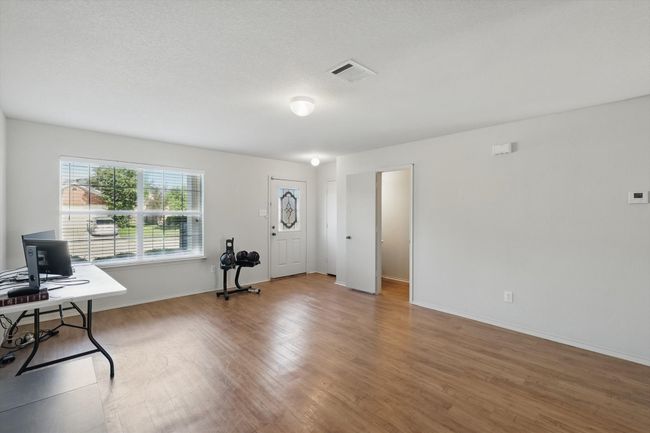 Foyer featuring wood finished floors and baseboards | Image 4