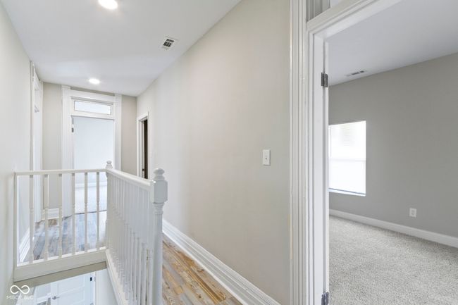 hall featuring an upstairs landing, baseboards, and recessed lighting | Image 25