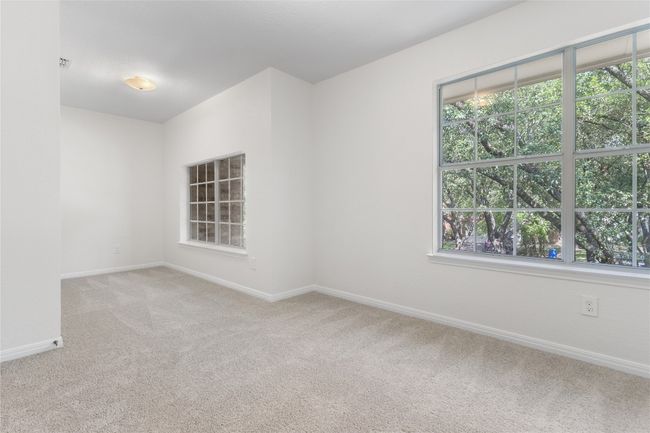 Unfurnished room with light carpet and healthy amount of natural light | Image 22