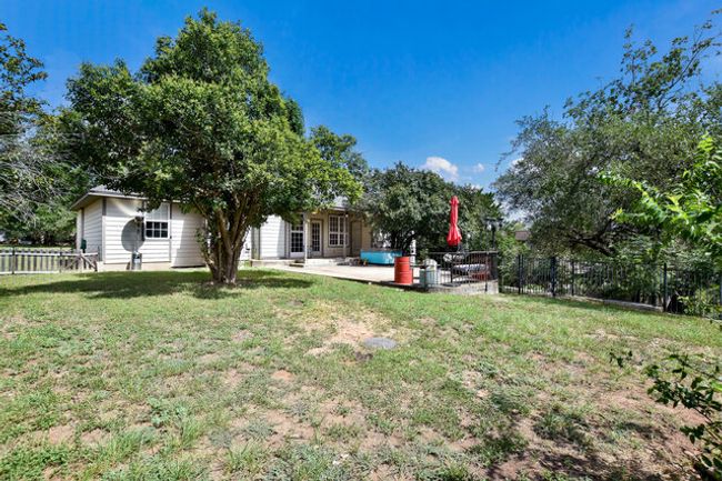 Fenced backyard featuring a patio area | Image 30