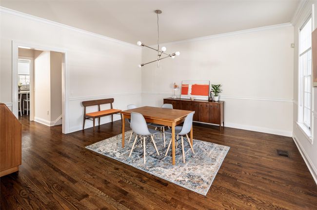 Spacious dining room with molding, dark hardwood floors. | Image 8