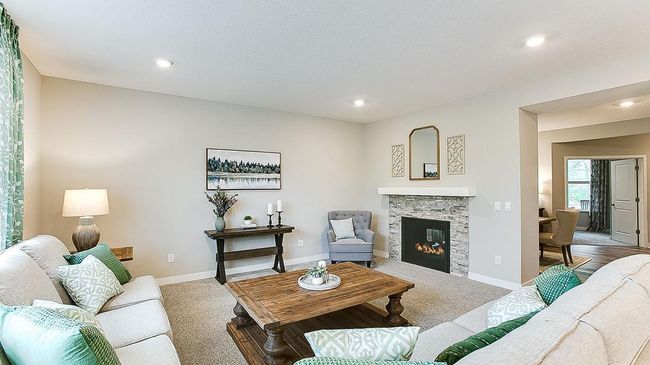 Family room with two-sided fireplace (formal dining is opposite). The perfect place to cozy up and relax at the end of a long day! | Image 17