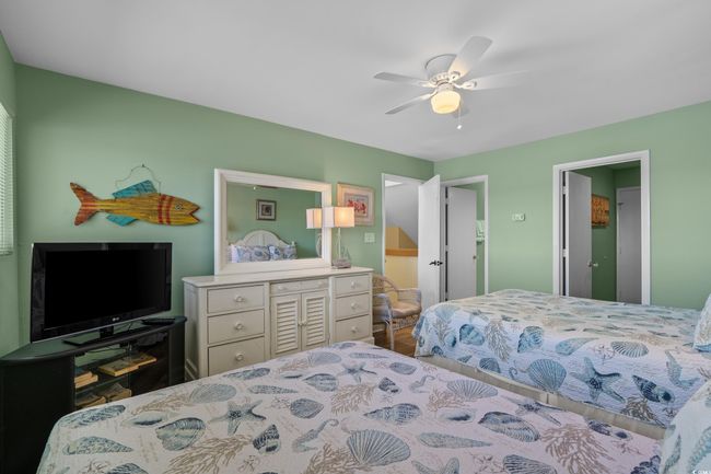 Bedroom featuring a ceiling fan | Image 27
