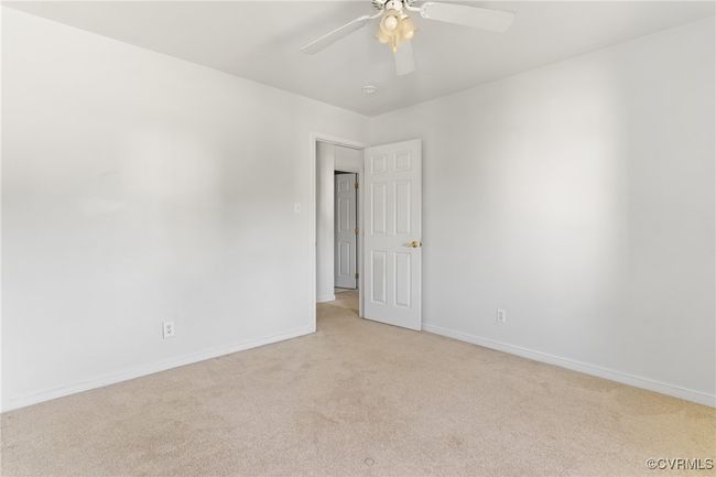 Spare room with light carpet and a ceiling fan | Image 27