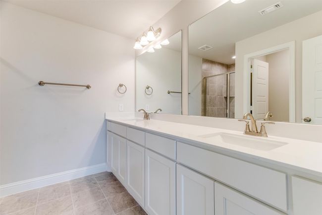 Bathroom featuring an enclosed shower and vanity | Image 22