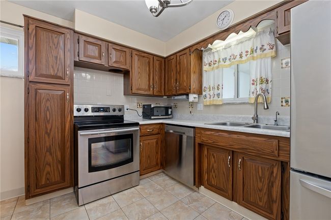 The Chef Of The Home Will Love Cooking In Kitchen Featuring Stainless Appliances | Image 8