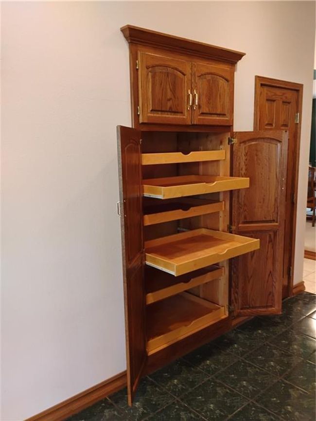 Kitchen pantry storage with roll out storage. | Image 41