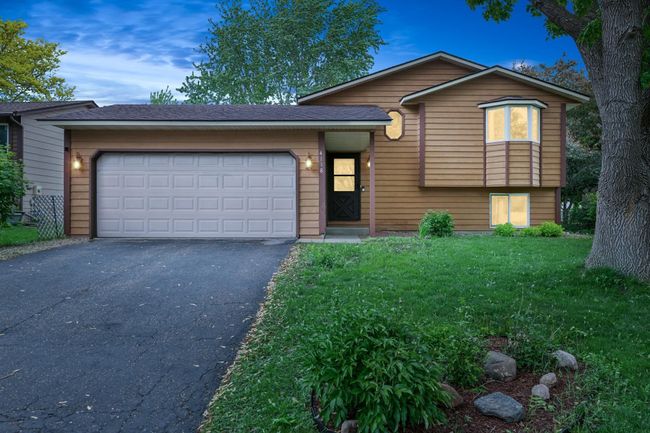 A welcoming, digitally enhanced twilight view of the home. | Image 25