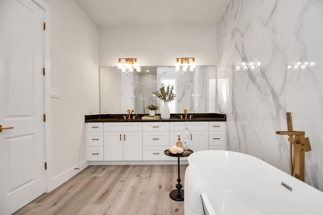 Double sinks, upgraded faucets and design, upgraded light fixtures, handles on cabinets- this home has it all! | Image 18