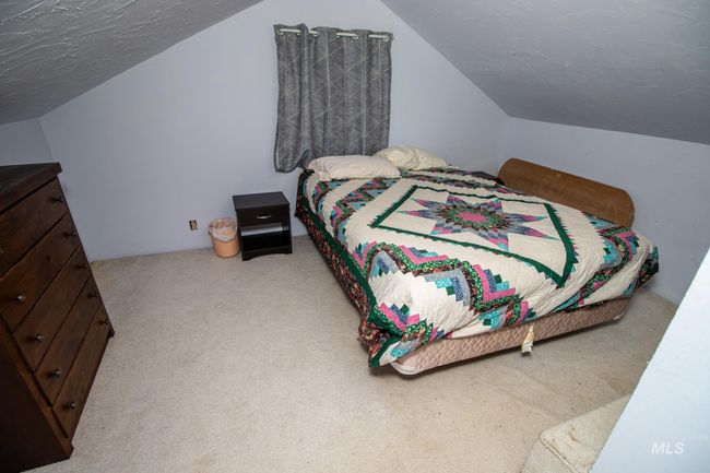 Bedroom featuring carpet flooring and lofted ceiling | Image 32