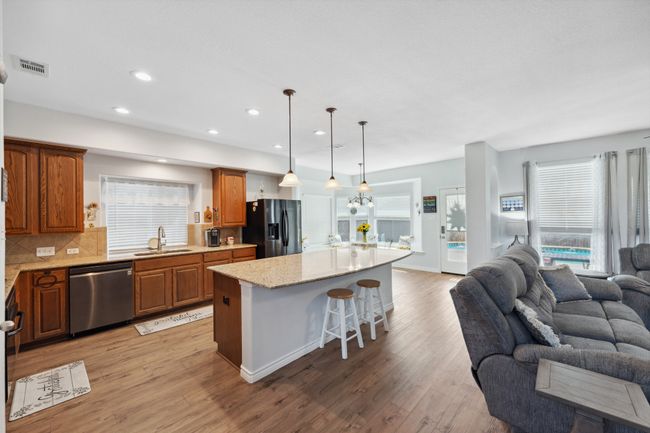 Granite, gas stovetop, electric oven with tons of decorative lighting | Image 13