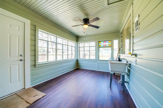 Unfurnished sunroom with wooden ceiling and ceiling fan | Image 31
