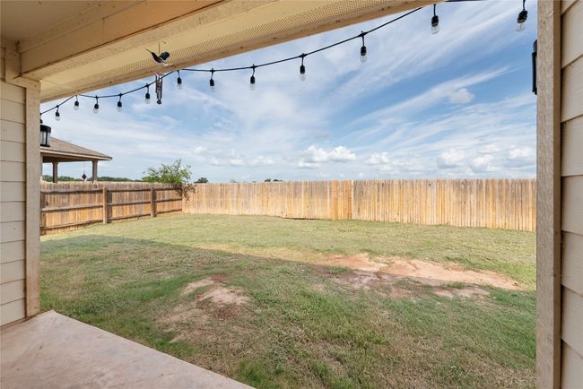 View of fenced backyard | Image 20