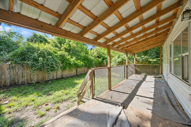 View of fenced backyard | Image 20