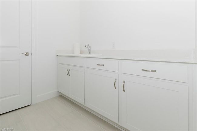 Bathroom featuring vanity and baseboards | Image 8