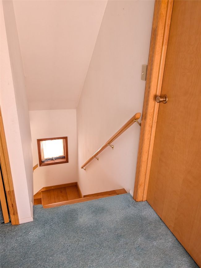 Stairway with lofted ceiling and carpet flooring | Image 18