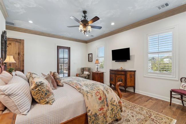 The French door provides direct access from the Owner's Suite to the patio, pool, and spa. | Image 22