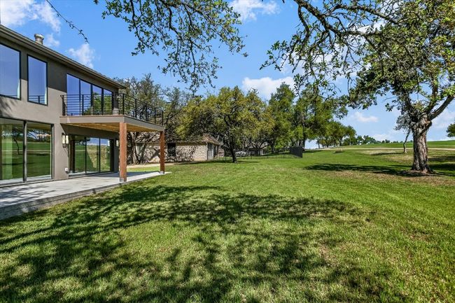 Large backyard overlooking 1st hole of golf course. | Image 17