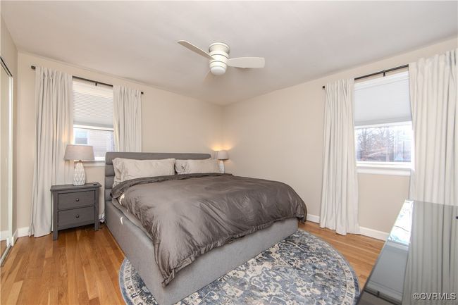 Bedroom featuring ceiling fan and light wood-type flooring | Image 24