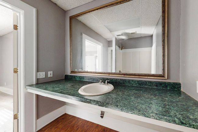 Bathroom with hardwood / wood-style flooring, a paneled ceiling, and vanity | Image 19