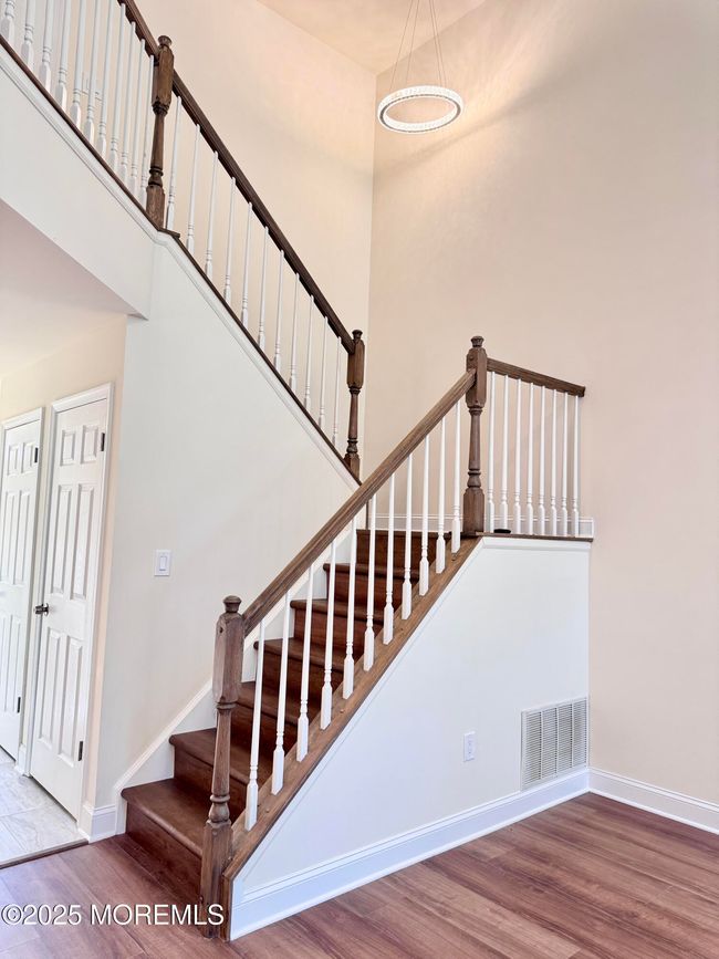 Open staircase, showing soaring ceilings. | Image 11