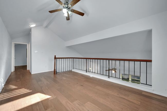 Additional living space with a ceiling fan and wood finished floors | Image 18