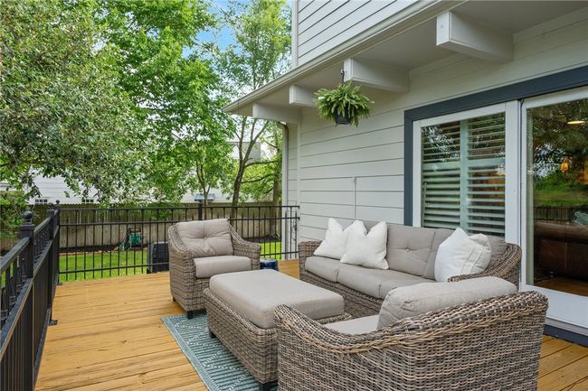 Deck with an outdoor hangout area | Image 33