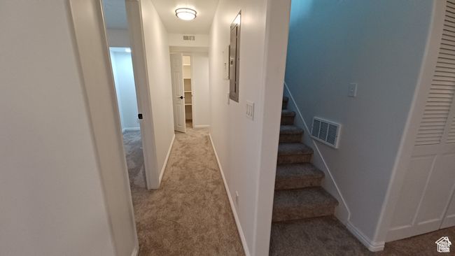 Hallway with light carpet and stairs | Image 26