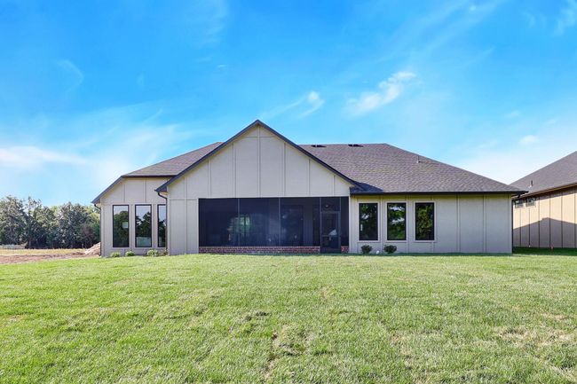 Back of house featuring a yard and a sunroom | Image 36