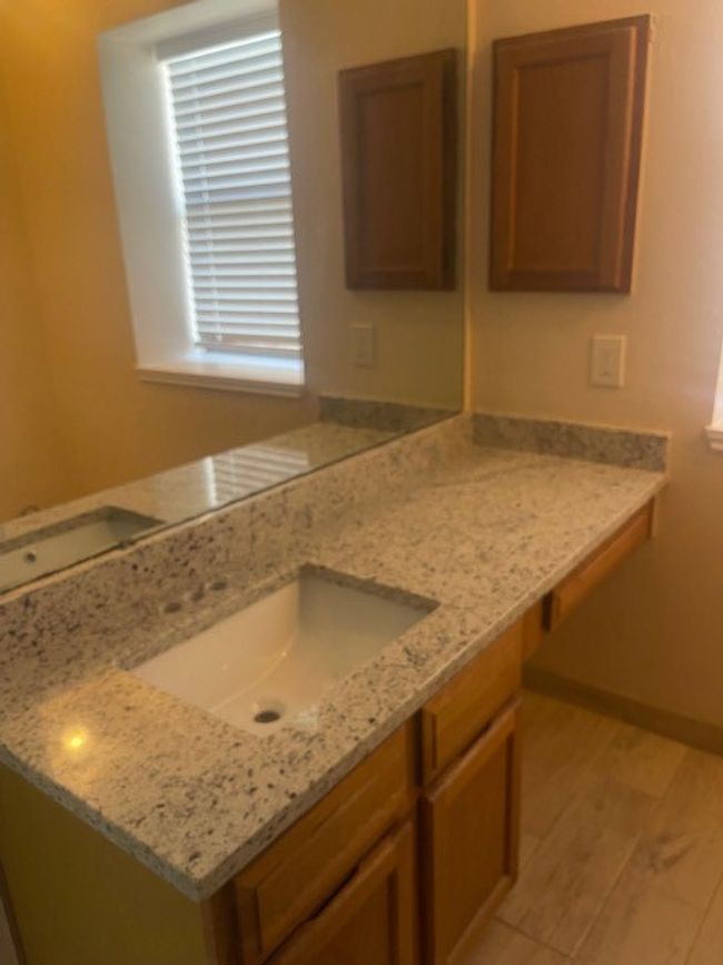 Makeup desk at the end of counter. Medicine cabinet. | Image 23