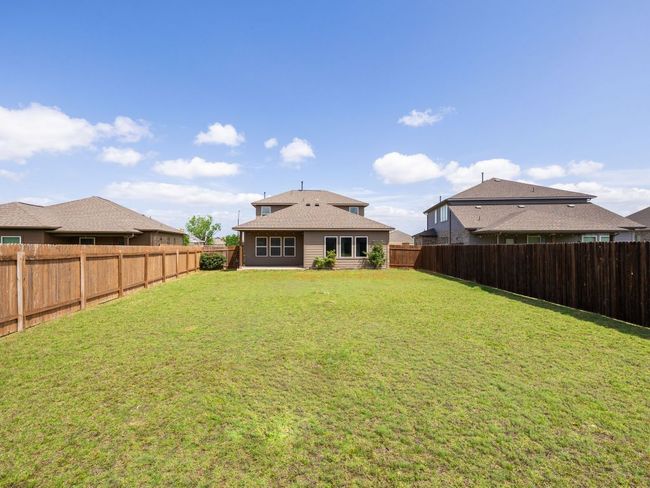 Rear view of property featuring a shingled roof | Image 28