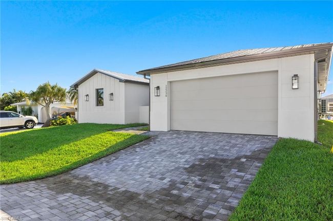Single story home with a garage and a front lawn | Image 41