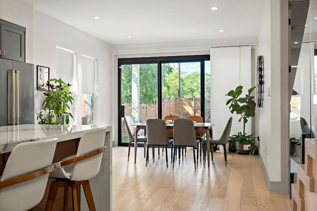 Dining area with light wood-style flooring and recessed lighting | Image 11