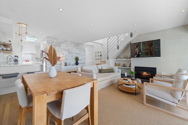 Dining room featuring recessed lighting, stairs, and a fireplace | Image 5