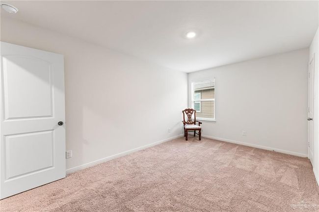 Carpeted empty room featuring baseboards | Image 30