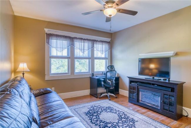 Family room featuring light hardwood / wood-style floors and ceiling fan | Image 11
