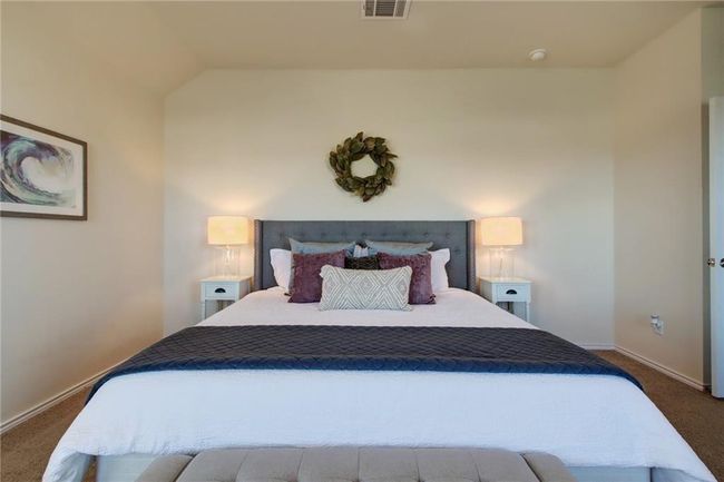 Bedroom featuring carpet and lofted ceiling | Image 20