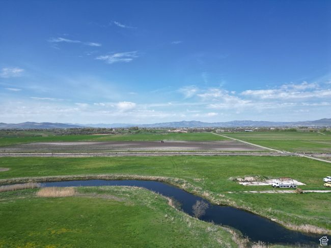 Overview from the East. View of the pond that runs behind the lot. | Image 5