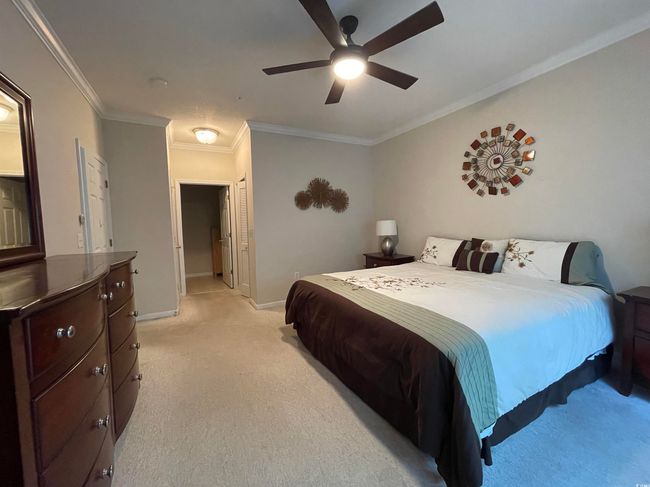 Primary Bedroom with En Suite, Walk In Closet, Crown Molding, Ceiling Fan and a Large Linen closet. | Image 15