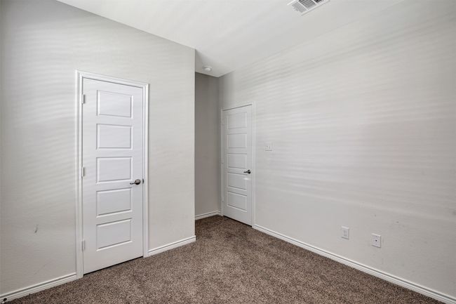 Unfurnished bedroom with carpet flooring and baseboards | Image 17