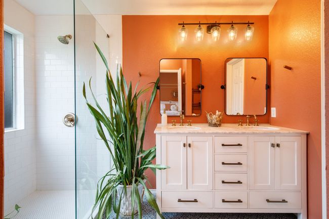 Full bath featuring tiled shower and double vanity | Image 14