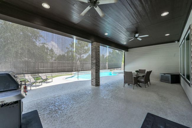 Escape from the sun outdoors w/ retractable solar shades. Perfect for entertaining | Image 29