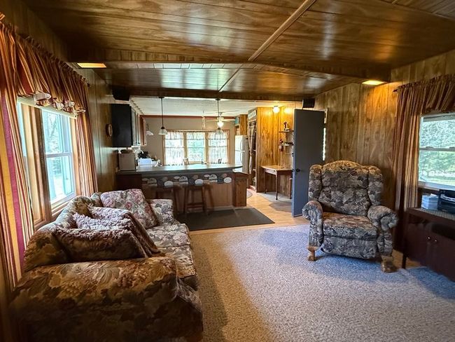 Living room that is open to the kitchen | Image 14