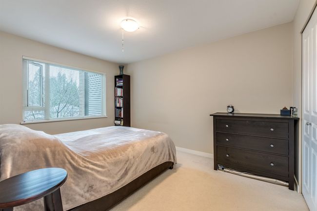 Carpeted bedroom featuring baseboards | Image 18