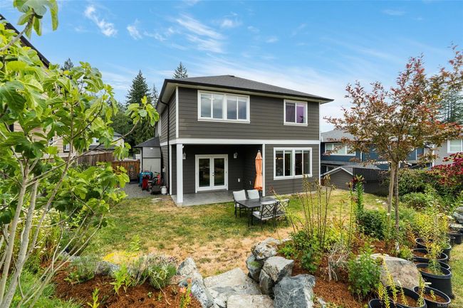 Back of property featuring a fenced backyard, a patio, and french doors | Image 26