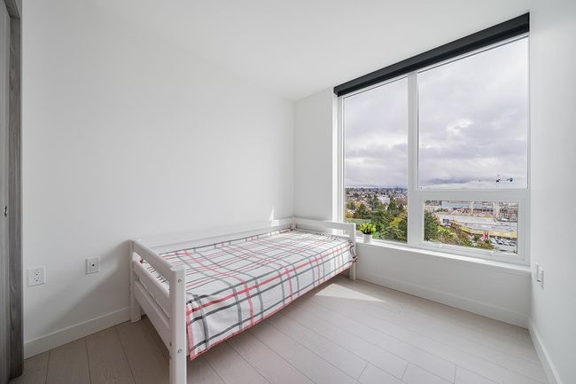 Bedroom featuring baseboards and wood finished floors | Image 13