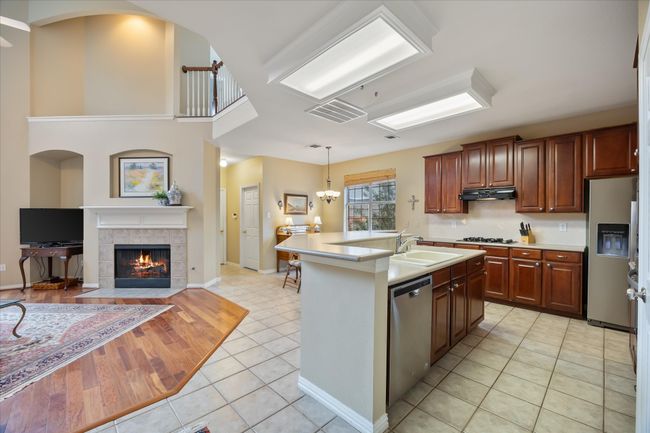Open floor plan features kitchen opening onto family room and breakfast area | Image 8