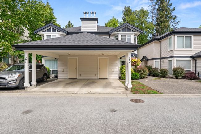 View of front facade featuring roof with shingles, driveway, and an attached carport | Image 4